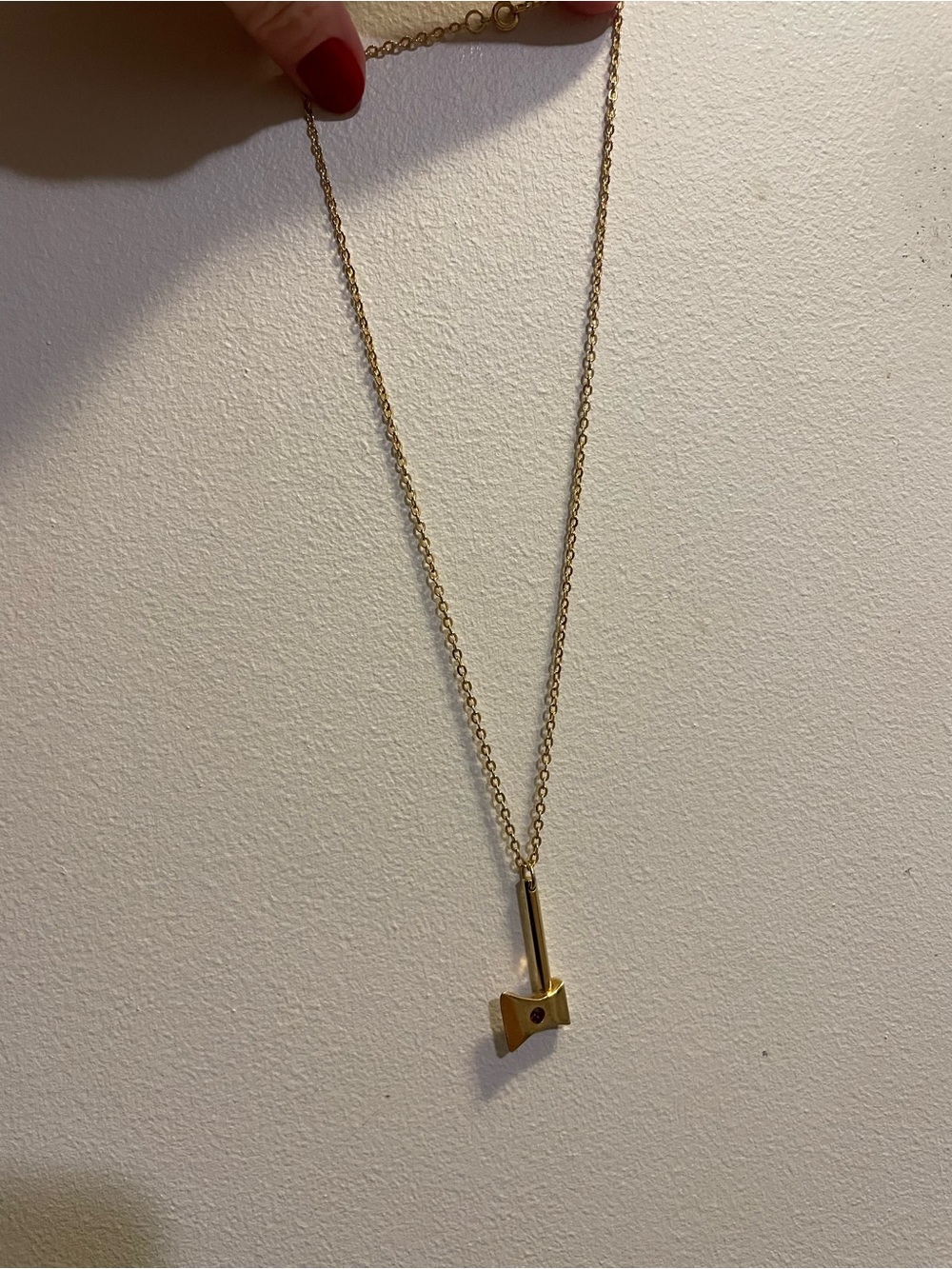 Gold axe Pendant Necklace with ruby Accent Stone